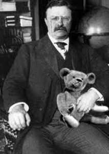 teddy rosevelt holding teddy bear